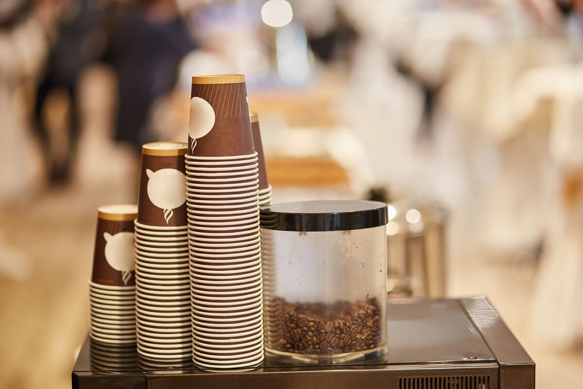 Branded disposable coffee cups.